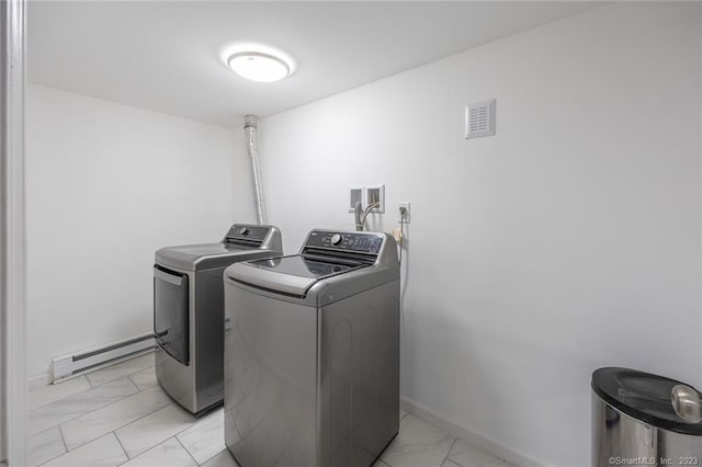 laundry area with marble finish floor, a baseboard heating unit, laundry area, independent washer and dryer, and baseboards