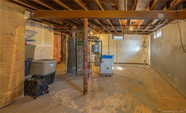 basement featuring a heating unit and gas water heater