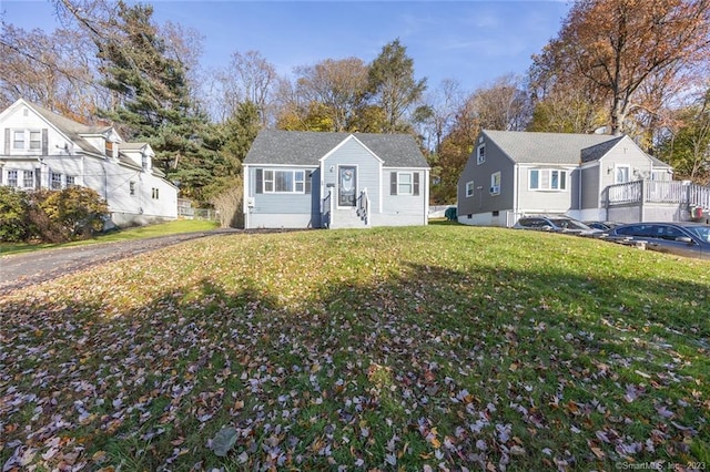 bungalow-style house featuring a front lawn