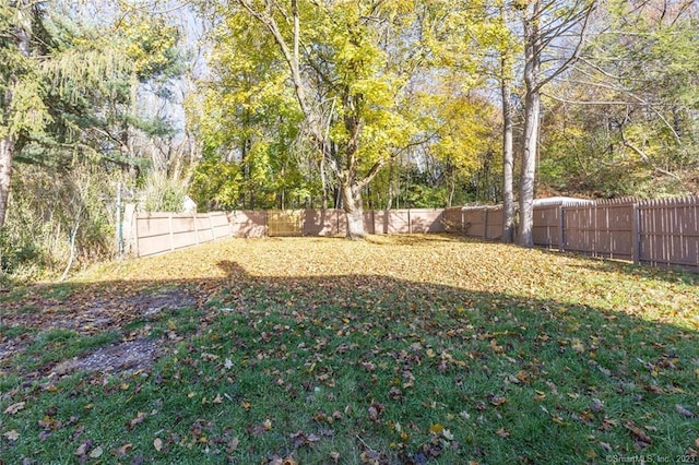 view of yard with a fenced backyard