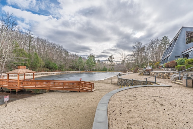 surrounding community featuring a gazebo and a water view