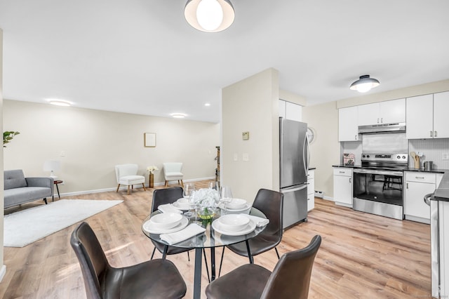 dining room featuring light hardwood / wood-style floors