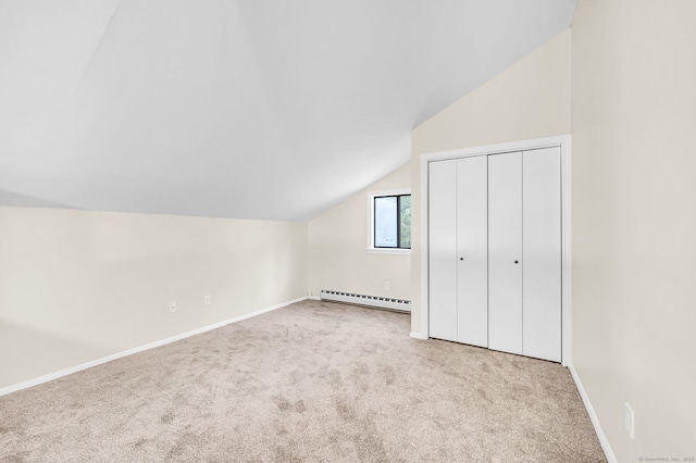 bonus room featuring a baseboard radiator, vaulted ceiling, and light colored carpet