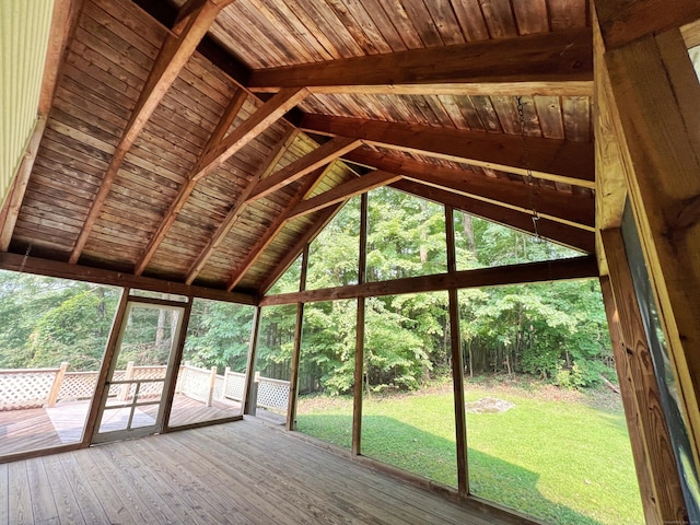 unfurnished sunroom with lofted ceiling with beams and wood ceiling