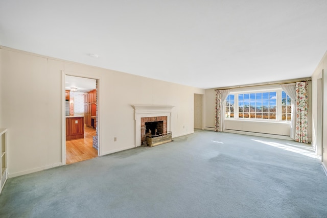 unfurnished living room featuring light carpet, a brick fireplace, and baseboard heating