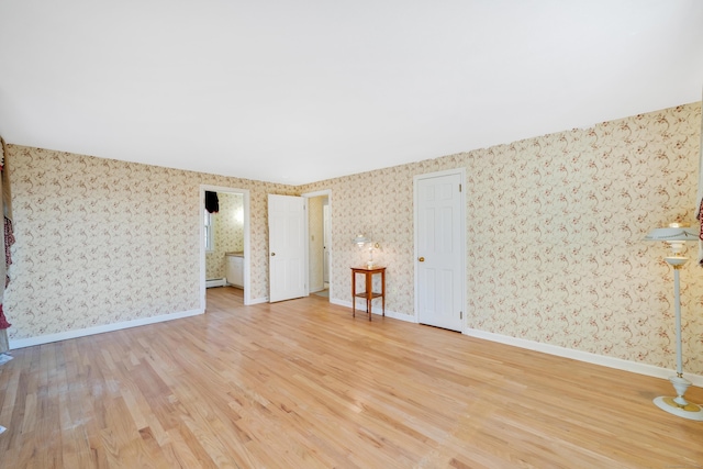 interior space with light hardwood / wood-style floors and baseboard heating