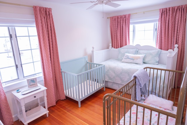 bedroom featuring hardwood / wood-style floors and ceiling fan