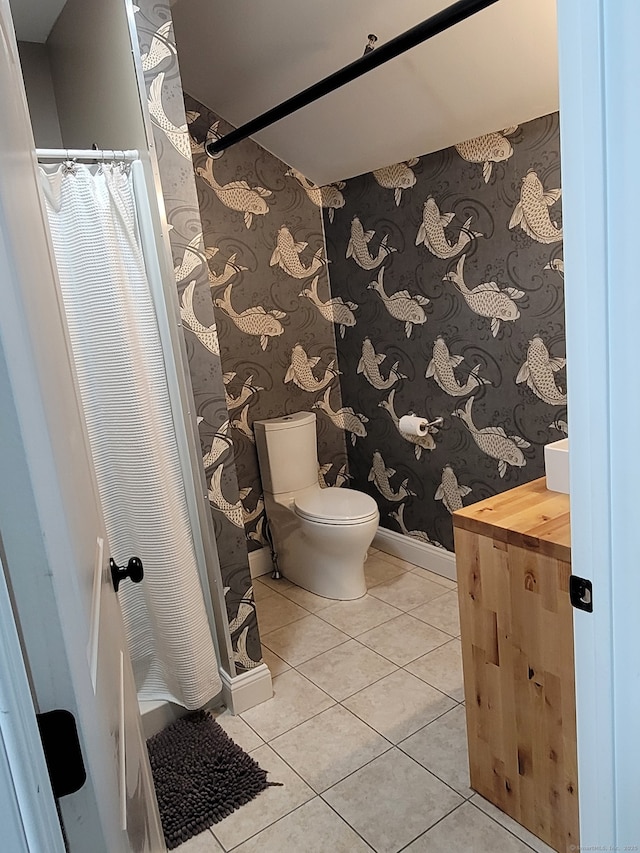 bathroom with tile patterned flooring and toilet