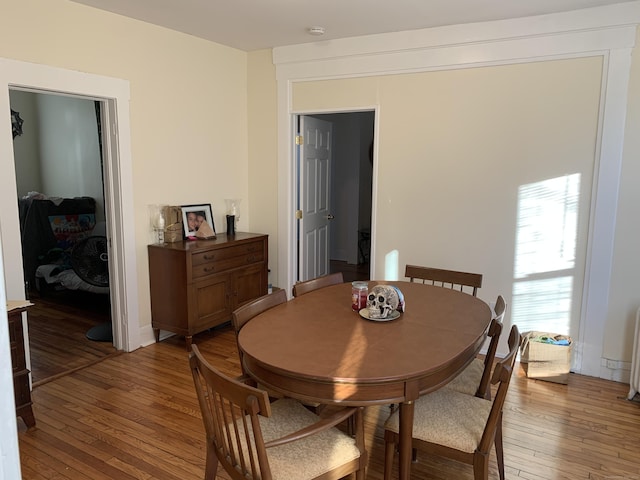 dining area with hardwood / wood-style floors