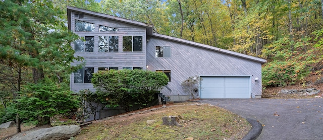 view of side of property with a garage