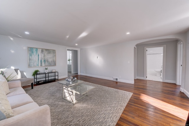 living room with dark hardwood / wood-style floors