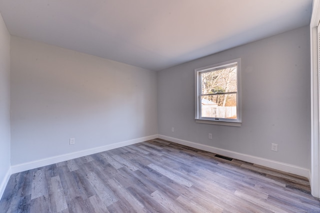 spare room featuring light hardwood / wood-style flooring