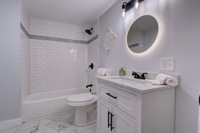 full bathroom with vanity, toilet, and tiled shower / bath