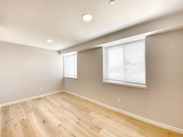 spare room featuring light hardwood / wood-style floors