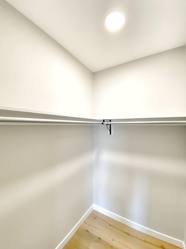 walk in closet featuring hardwood / wood-style floors