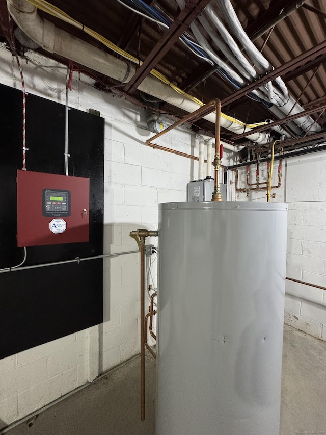 utility room featuring water heater