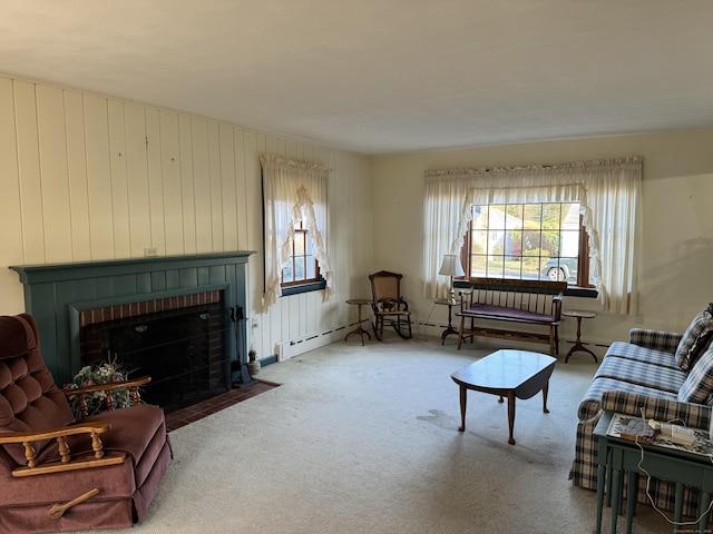 living room with carpet and a brick fireplace