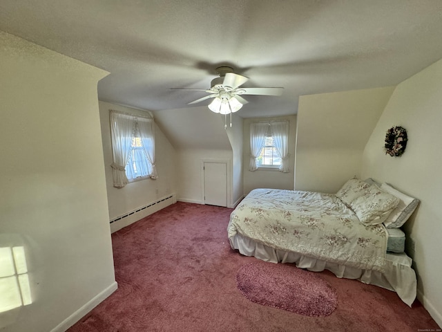 bedroom featuring baseboard heating, ceiling fan, carpet floors, and vaulted ceiling