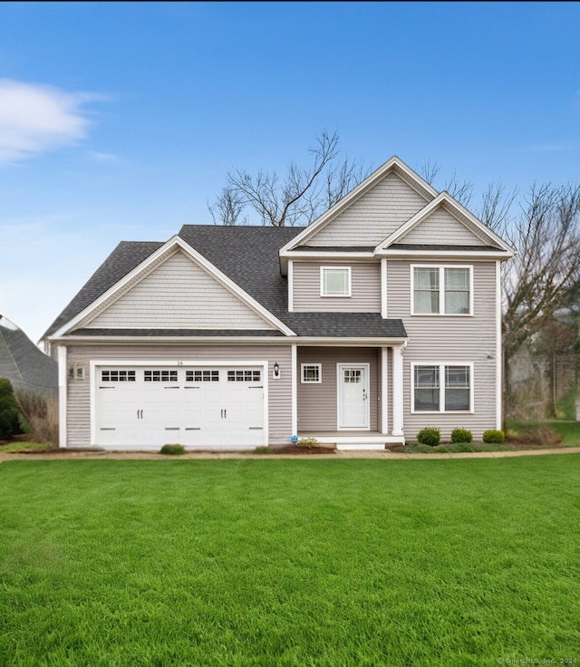 craftsman inspired home featuring a front yard and a garage