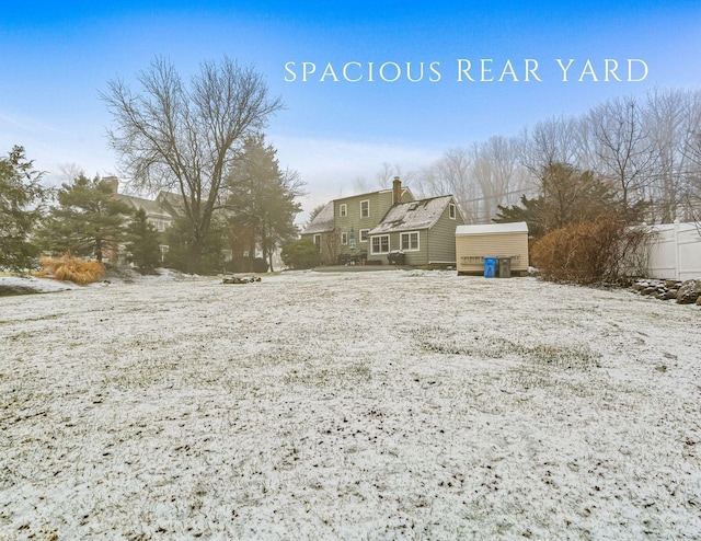 view of yard layered in snow