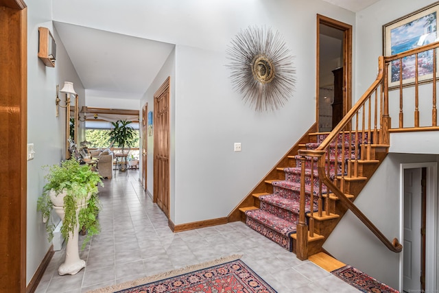 staircase with tile patterned floors