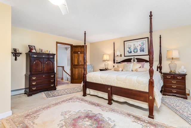 carpeted bedroom featuring ceiling fan and a baseboard radiator