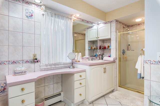 bathroom featuring baseboard heating, a shower with door, vanity, and tile patterned flooring