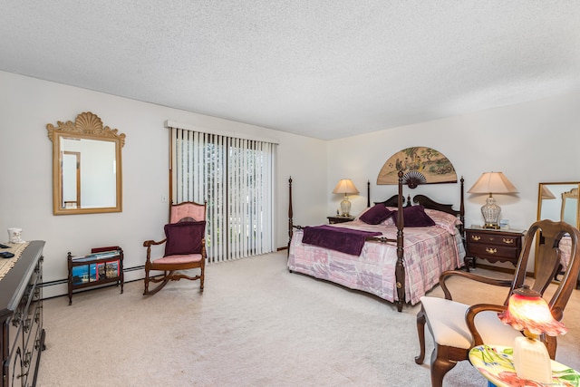 bedroom with a textured ceiling and light carpet