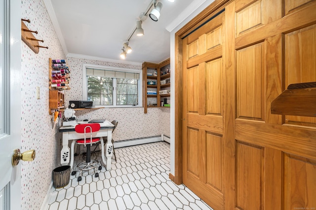 kitchen featuring ornamental molding and a baseboard heating unit