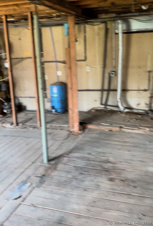 basement featuring hardwood / wood-style floors