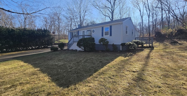 view of property exterior with a yard