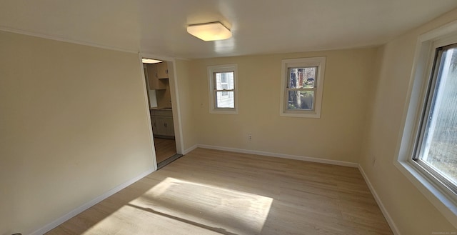 unfurnished room featuring light hardwood / wood-style floors