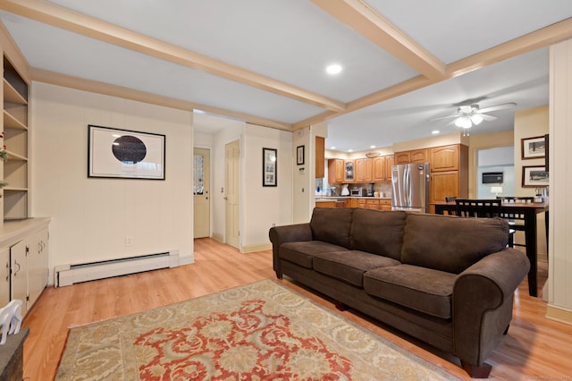 living room featuring beamed ceiling, ceiling fan, light hardwood / wood-style flooring, and a baseboard radiator