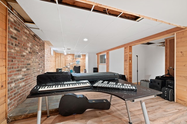 miscellaneous room with hardwood / wood-style floors and wood walls