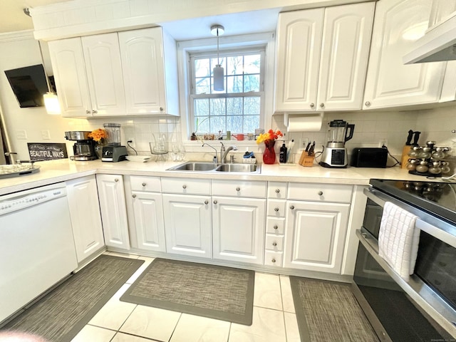 kitchen with white dishwasher, white cabinets, and range with two ovens