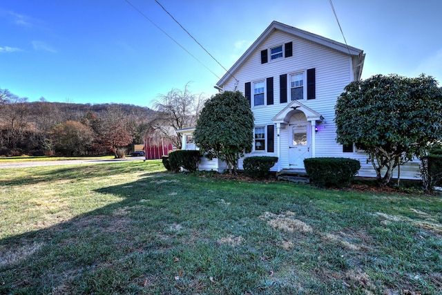 view of front of home with a front lawn