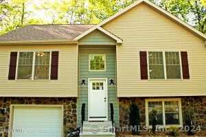 bi-level home featuring a garage