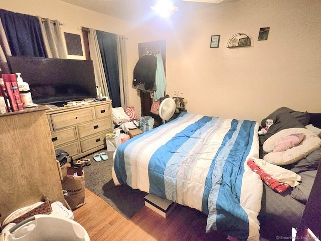 bedroom featuring hardwood / wood-style floors