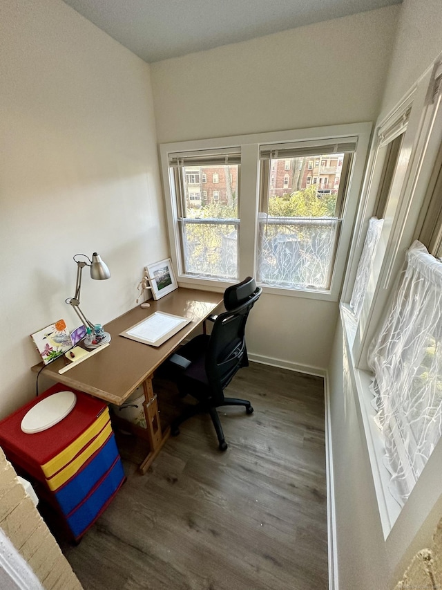 office featuring dark hardwood / wood-style floors and lofted ceiling