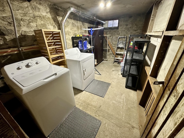 clothes washing area with washer and dryer