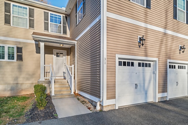 doorway to property featuring a garage