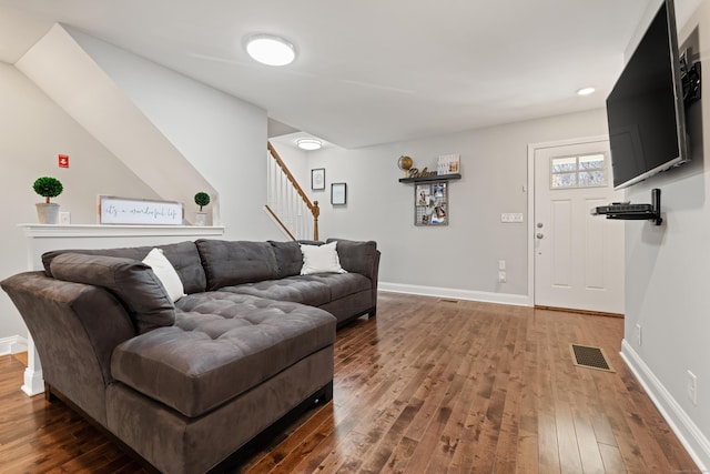 living room featuring dark hardwood / wood-style floors