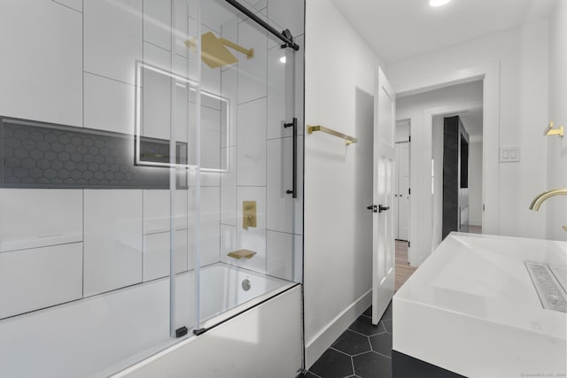 bathroom with vanity, tile patterned flooring, and enclosed tub / shower combo