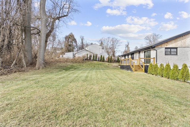 view of yard featuring a deck