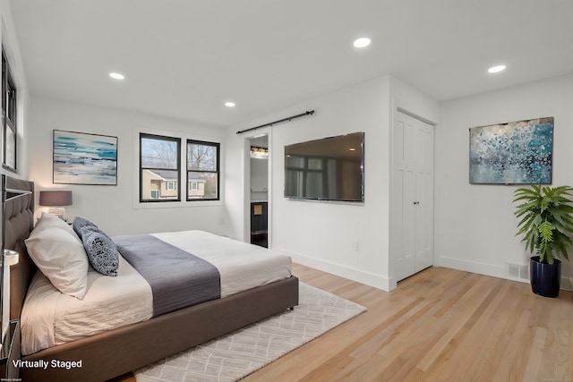 bedroom with light hardwood / wood-style flooring