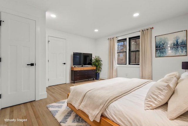 bedroom with light wood-type flooring