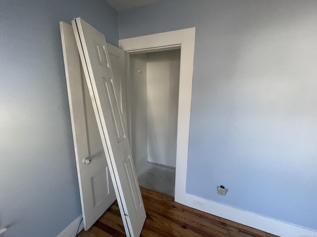 interior space with dark hardwood / wood-style flooring