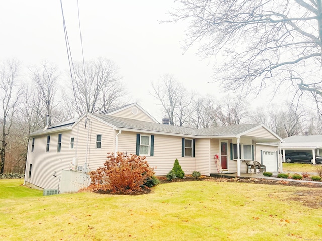 view of front facade featuring a front yard and a garage