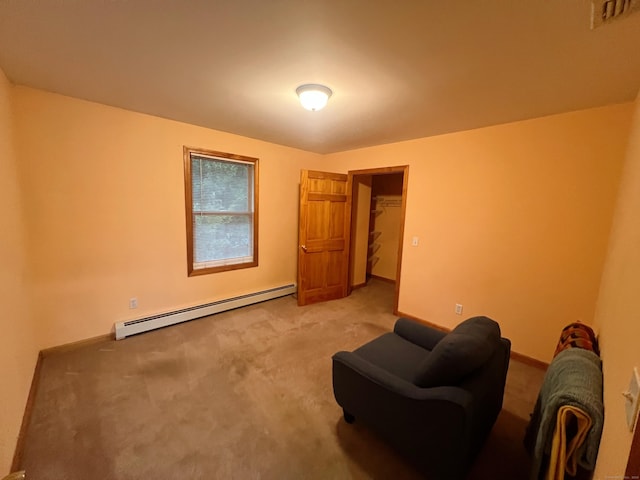 living area featuring baseboard heating and light carpet