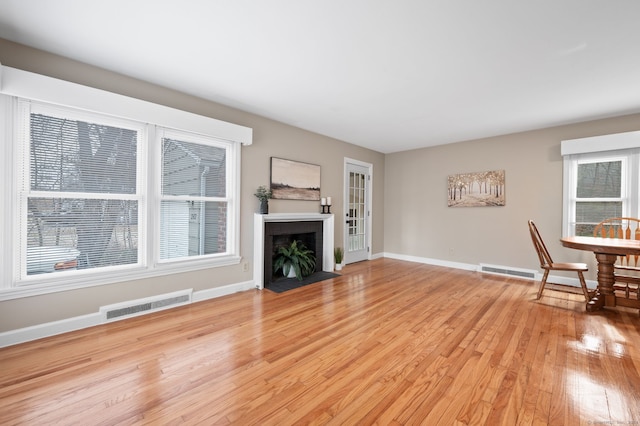 unfurnished living room with light hardwood / wood-style floors